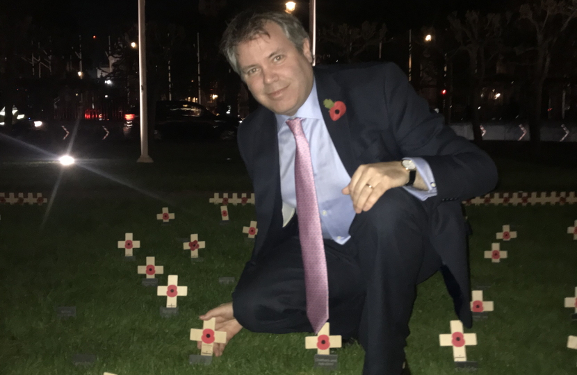 Edward places memorial cross