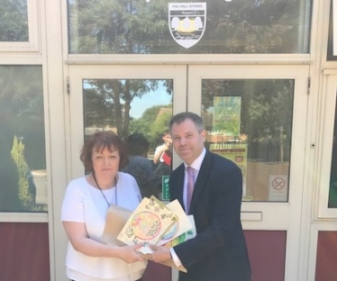 Edward with The Hall School Headteacher and pupils' work