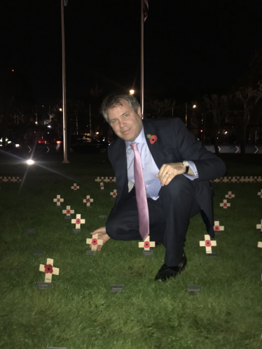 Edward places memorial cross