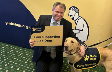 Edward with a guide dog